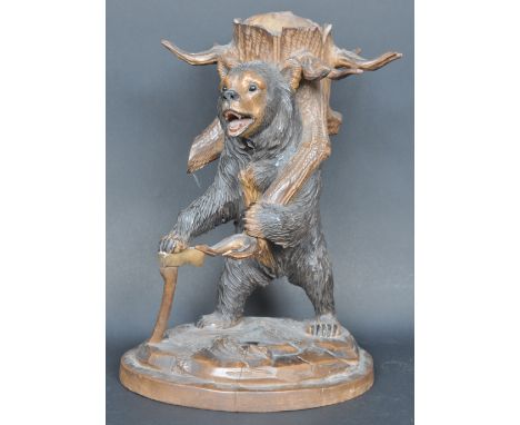 A 19th Century Victorian hand carved Black Forest bear pipe stand / pipe holder of good proportions. The bear modelled standi