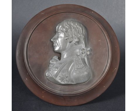 An early 20th Century pewter portrait image depicting Lord Admiral Nelson. The image cast from pewter and mounted on wooden s