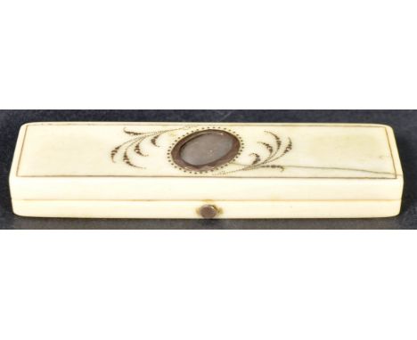 An 18th Century ivory and gold toothpick case having an oval cartouche with gold leaves. The hinged lid opening with push but