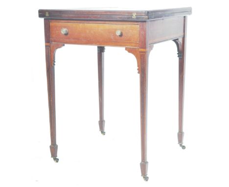 A 19th Century Victorian mahogany envelope card / games table having a four section folding metamorphic top with inlaid borde