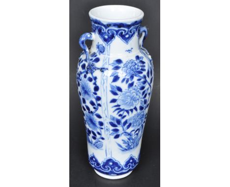 A 19th Century Chinese Qing Dynasty Kangxi blue and white porcelain vase having hand painted decoration depicting blossoming 