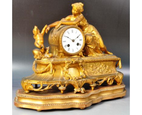 An early 20th Century French ormolu mantel clock by Japy Freres of Paris. The clock having a white enamel face and barrel cyl
