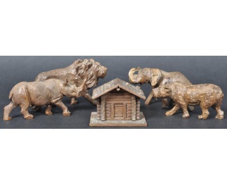 A selection of 19th Century Victorian carved wood animals to include a Lion, Leopard, Rhino and Elephant all with carved deta