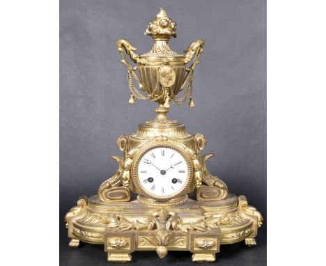 Japy Freres of Paris - A late 19th Century French ormolu mantel clock featuring a large urn finial atop with fruit to the top