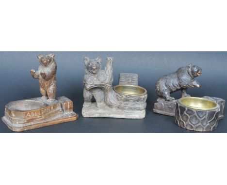 A collection of three 19th Century German hand carved Black Forest bear figural desk items comprising an inkwell / pipe stand