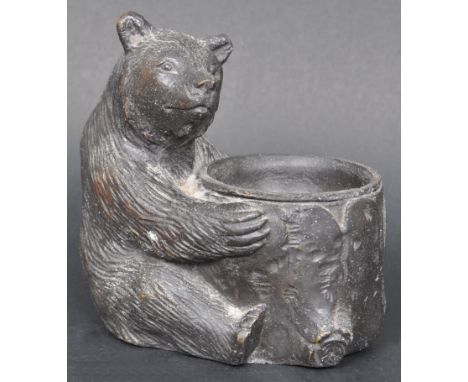 A 19th Century Victorian Black Forest manner spelter match strike in the form of a bear. The bear modelled and cast in an upr