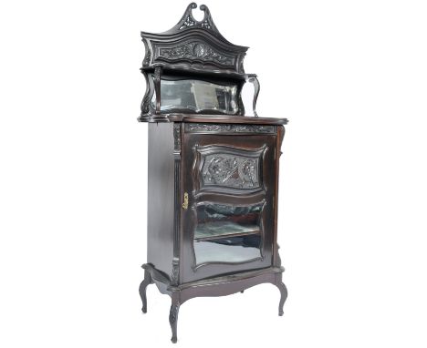 A 19th Century Victorian ebonised mahogany Art Nouveau music cabinet of pedestal form with upright mirror back gallery with c