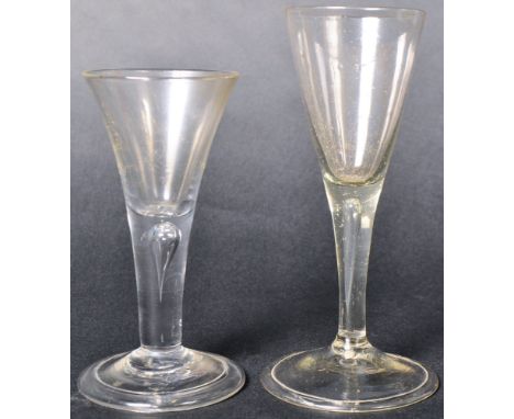 Two mid 18th Century George II glass wine drinking glasses comprising an example with bell shaped bowl with single flint tear