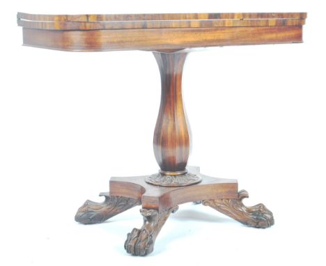 A 19th Century WIlliam IV rosewood games / card fold over table. The table having a rounded rectangular top with shaped friez