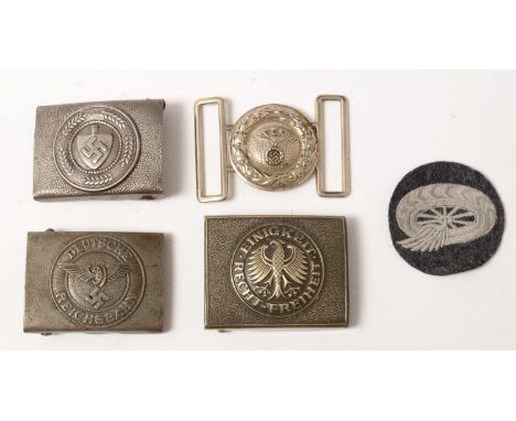 A group of three WWII and later German belt buckles and a cloth patch, comprising; a Deutsche Reichsbahn belt buckle, and clo