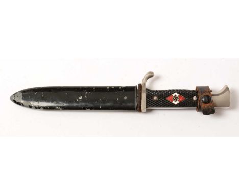 A WWII Hitler Youth knife, the 14cms blade with makers mark for Hubertus Solingen, chequer grip with inset red and white enam