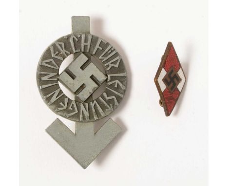 A WWII Hitler Youth Proficiency badge, in silver, with needle pin and marked RZM M1/34, 5.1 x 3.1cms; Together with a Hitler 