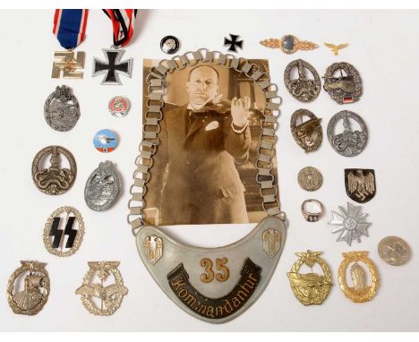 A collection of reproduction WWII German award badges and medals, comprising 1939 Iron Cross, with suspension ribbon; a Komma