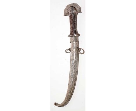 A Moroccan Koummya or Jambiya, the 24cms curved double-edged blade with makers mark, on a hilt of typical form inlaid with si