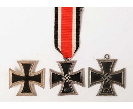 A group of three 1939 Iron Crosses, comprising a first class award, with sword shaped pin, the pin marked 113; a second class