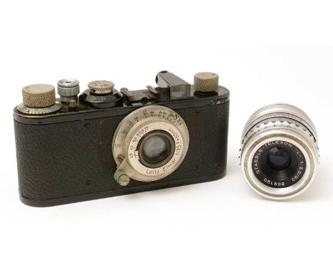 A Leica I 35mm camera in black, serial no. 31201, the standardized len-mount fitted an Elmar 50mm f3.5 collapsible lens, in l