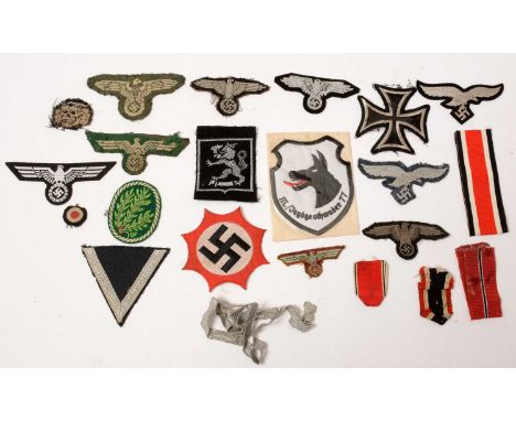 A collection of WWII and later German cloth badges, comprising; two German Army breast badges; four Waffen-SS arm badges; two