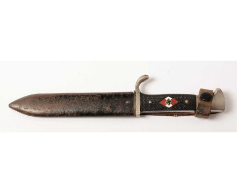 A WWII Hitler Youth knife, the 14cm single-edged blade, marked RZM M7/60, chequer grip with inset red and white enamel badge,