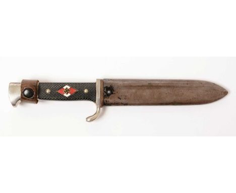 A WWII German Hitler Youth knife, the 12cms blade marked RZM M7/10 and dated 1939, with black chequer grip handle with inset 