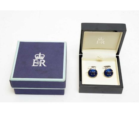 A gift from HRH Queen Elizabeth II, undated, a pair of blue enamel plated metal cufflinks, boxed.Provenance: The vendor's wor