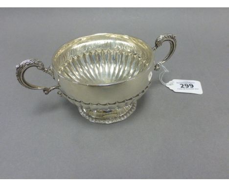 A silver two handled bowl, with semi reeded decoration, London 1898, Goldsmiths & Silversmiths Co ( William Gibson & John Law