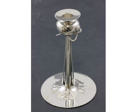 A single silver candlestick, with a removable drip tray, stylised buds and leaf motifs, by Liberty & Co, Stamped L & Co, Cymr