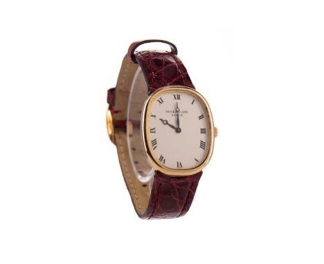PATEK PHILIPPE ELLIPSE EIGHTEEN CARAT GOLD MANUAL WIND WRIST WATCH,the oval dial with Roman hour markers, 23mm case, on a red