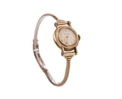 LADY'S JAEGER LE COULTRE NINE CARAT GOLD MANUAL WIND WRIST WATCH,the round cream dial with applied baton and Roman hour marke