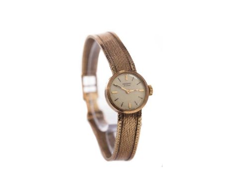 LADY'S RECORD DE LUXE NINE CARAT GOLD MANUAL WIND WRIST WATCH,the round cream dial with baton hour markers, 17mm case, 21g, l