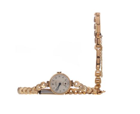 LADY'S BUREN NINE CARAT GOLD MANUAL WIND WRIST WATCH,the round silver coloured dial with Arabic hour markers, outer seconds t
