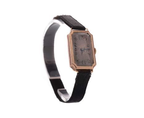 LADY'S NINE CARAT GOLD MANUAL WIND WRIST WATCH,the rectangular dial with Arabic hour markers, inner seconds track in black, 1