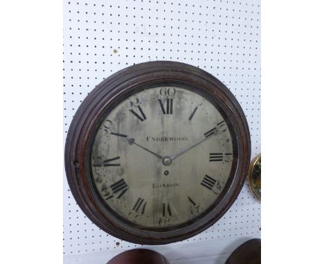 A Victorian circular mahogany framed wall clock by Underwood of London. The silvered dial has a Roman numeral chapter ring wi