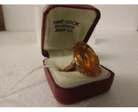 9ct gold dress ring set with a large oval cut tangerine colour stone (25mm x 18mm approx)