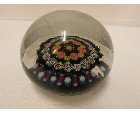 Paperweight with green ground, cog and millefiori canes, outer ring of purple and blue canes, pontil, perhaps English, late 1