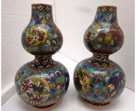 Pair of early 19th century Chinese double gourd cloisonne enamel vases, blue ground with circular vignettes, floral patternin
