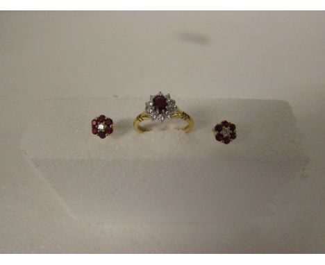 Ruby and diamond cluster ring on 18ct gold shank (total weight 3.8g) with a pair of corresponding ruby and diamond earrings w