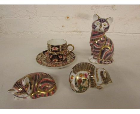 Three Royal Crown Derby cats - seated cat, gold button, initialled m m (height 13cm); sleeping Imari kitten, gold button (8cm