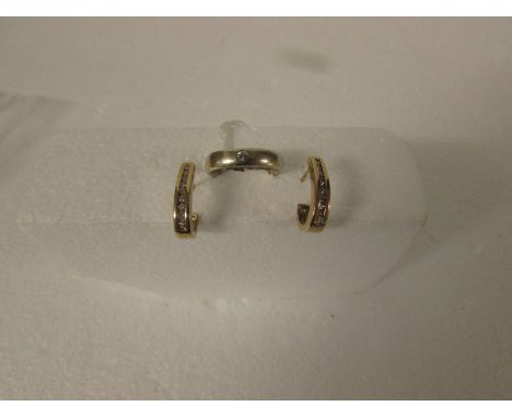 9ct gold ring set with small diamond in flush setting, (4.1g) and a pair of yellow metal earrings each set with nine chip dia