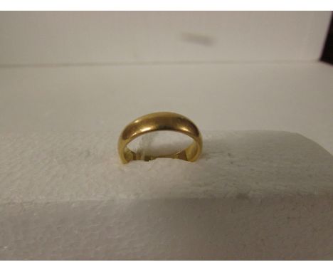 Yellow metal wedding ring, engraved 2.6.23 and initials within, no assay marks, 6.6g