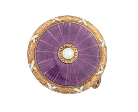 the circular brooch set with a central seed pearl surrounded by a 'shield' pattern in purple enamel and with gilt and white d