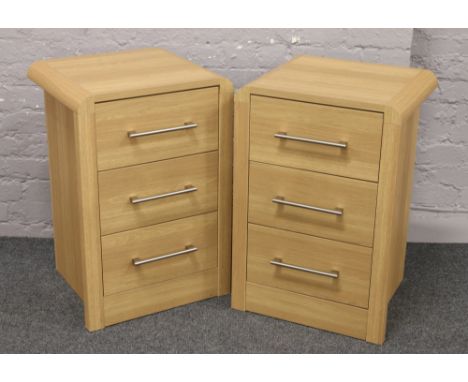Two modern light oak effect bedside chest of drawers with chrome handles, 75cm high, 50cm width, 48cm depth.