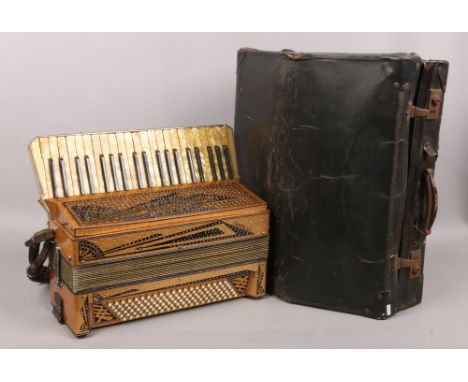 A cased vintage Castello Settimio Soprani accordion with gold glitter and diamonte decoration.