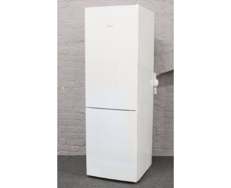 A Siemans white enamel tall standing electronic fridge freezer model KG36 VVW30G, 187cm high, 60cm wide, 63cm deep.