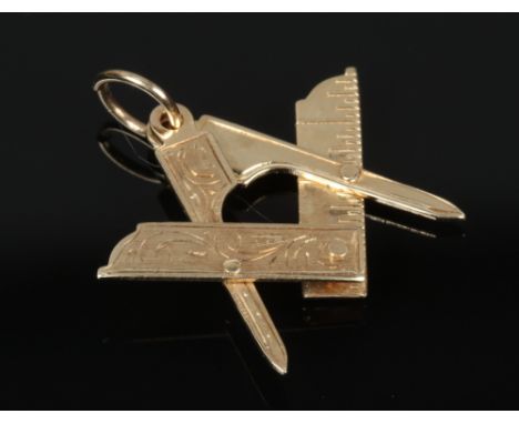 A 9ct gold Masonic pendant / fob formed as the square and compass motif, assayed Birmingham 2000, 2.3 grams.&nbsp;