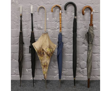 Six vintage umbrellas to include curved wooden handle examples etc.