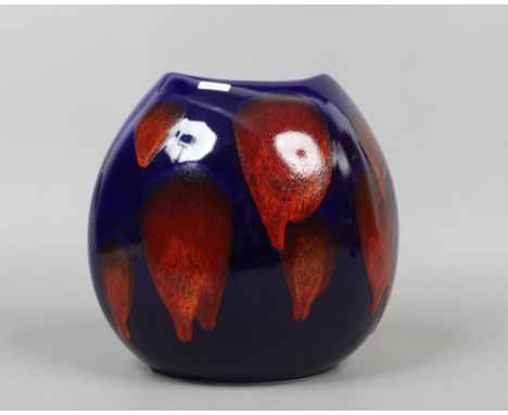 A large Poole pottery purse vase with blue and red glaze.