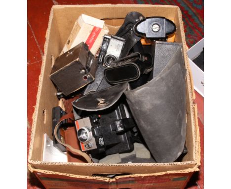 A box of photographic equipment to include disc cameras, Polaroid, box camera, lenses etc.