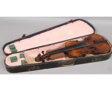 A cased vintage violin in need of restoration. (Back Length 33.5cm)