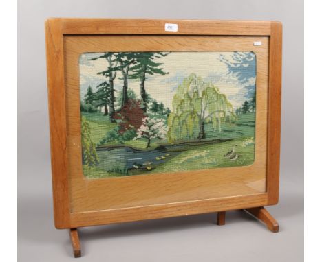 A light oak woolwork firescreen / occasional table.