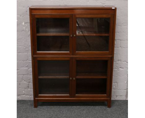 A mid 20th mahogany stacking glazed bookcase, 112cm x 86.5cm x 20cm.Condition report intended as a guide only.Lacking one gla